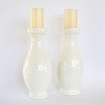 White bottle-shaped pillar candleholders